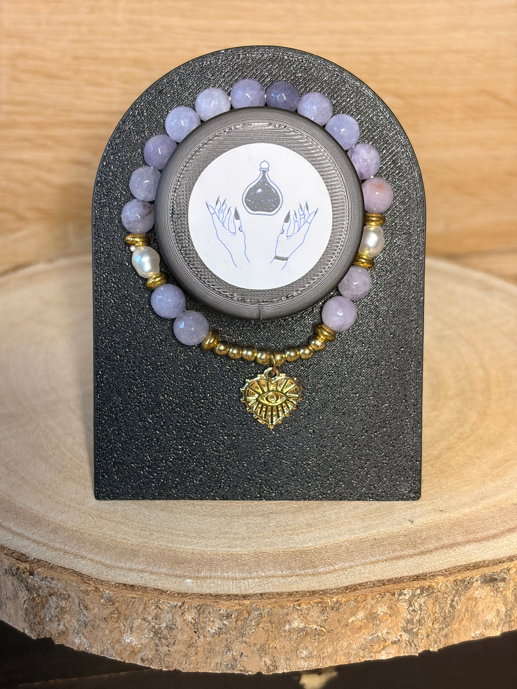 Iolite bead bracelet with eye charm
