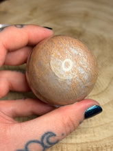 Load image into Gallery viewer, Peach moonstone sphere with blue flash
